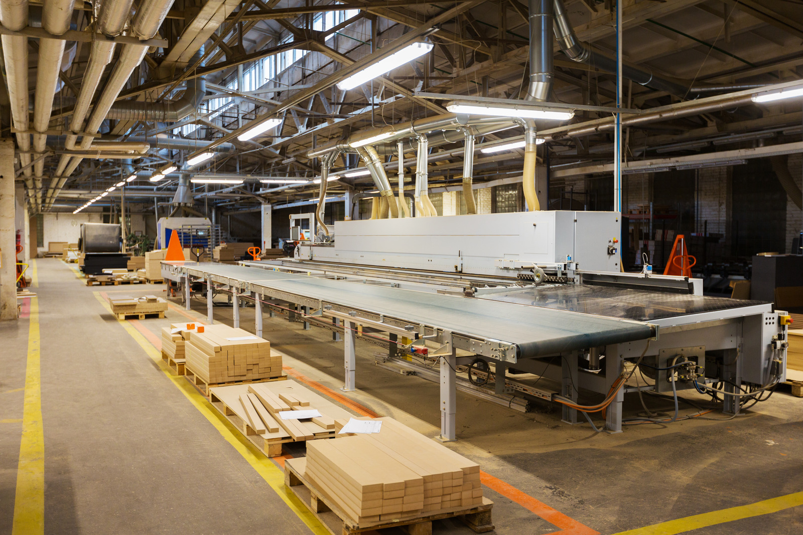 chipboards on conveyer at furniture factory